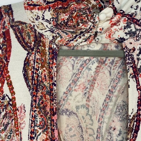 Boho and Gypsy style dress by Free People. Has an open back and elastic sleeves. - Picture 5 of 6